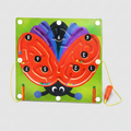 Butterfly magnetic labyrinth game with colorful background of toys